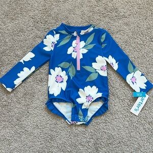 This is a Carter’s Blue Floral Toddler Girl Swimsuit